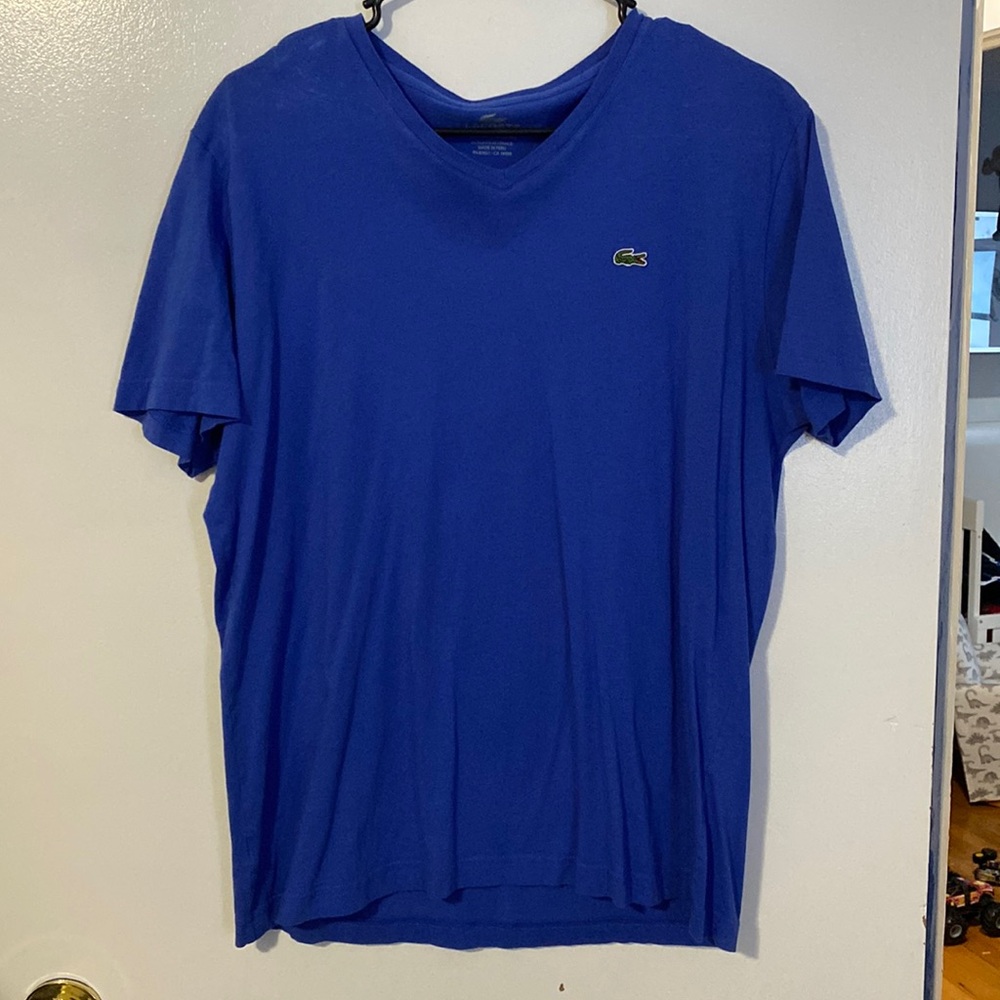 Lacoste- size 6- blue v neck mens